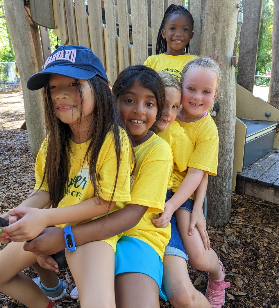 Group of kids smiling together at the park